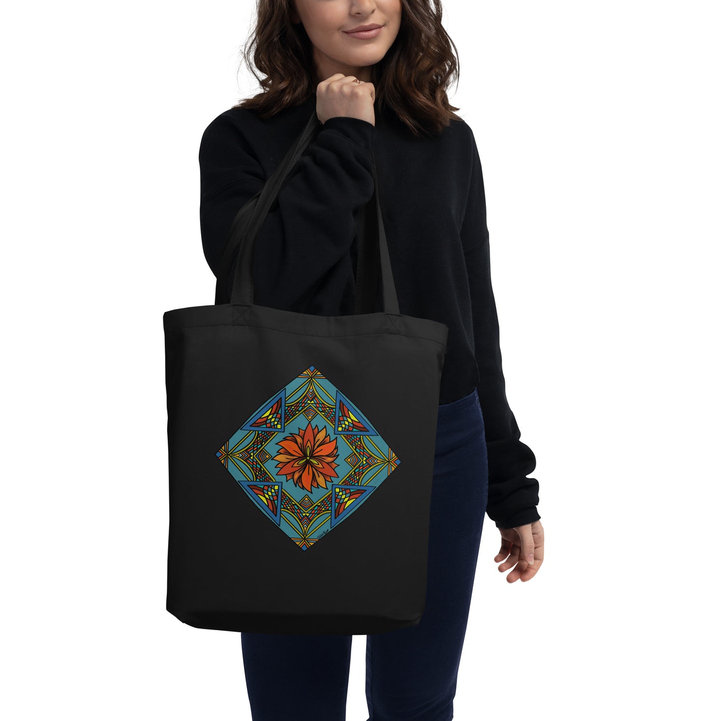 Product mockup-with model holding tote bag featuring Fiery Radiance Mandala design