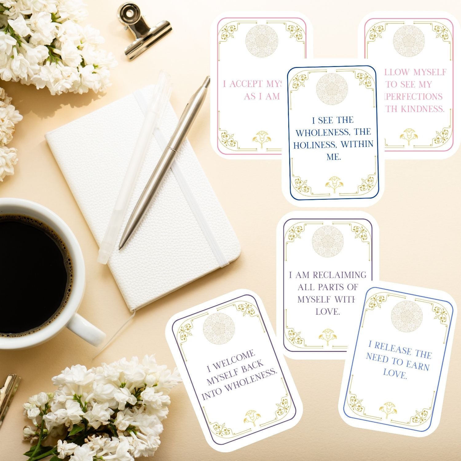 Isis Sacred Love affirmation cards displayed on a desk with journal and coffee, showing printable daily affirmations for self-love, acceptance, and embodied wholeness