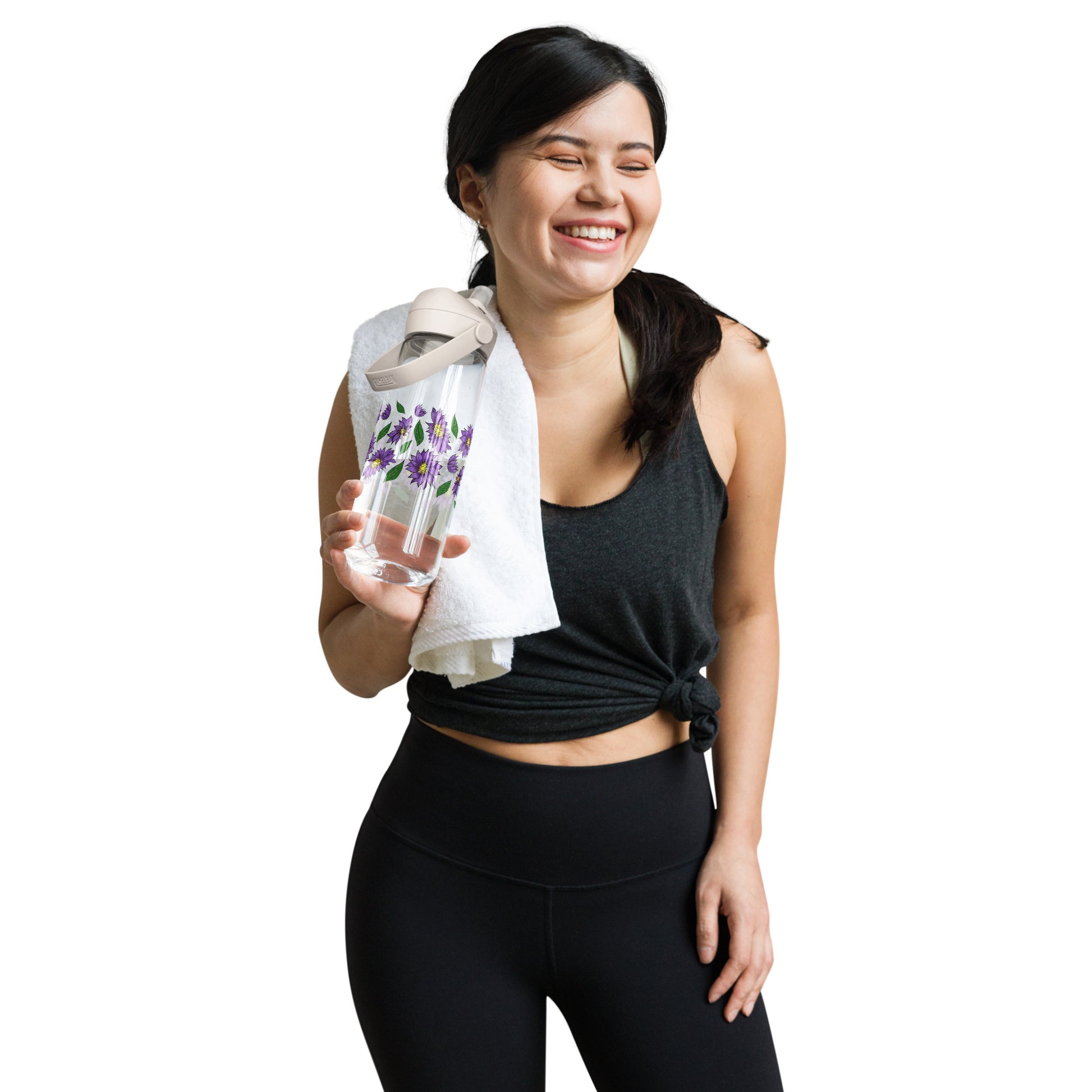 Woman in athletic wear holding a Purple Daisies Flip Straw Water Bottle clear