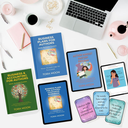 Flat-lay lifestyle image showing the complete Indie Author Business System by Tora Moon, including the Business Plans for Authors print book, Business & Accounting for Authors print book, the Author Mindset Mastery Program, the companion workbook, and affirmation cards displayed on tablets and devices on a creative author desk.